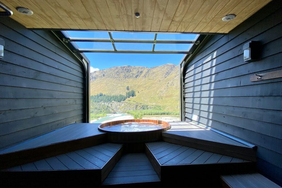 brown wooden table near window